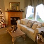 Living room with carpet and fireplace